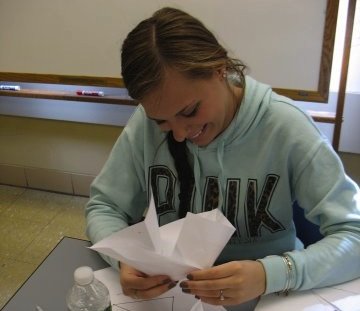 Student exploring straight-cut origami